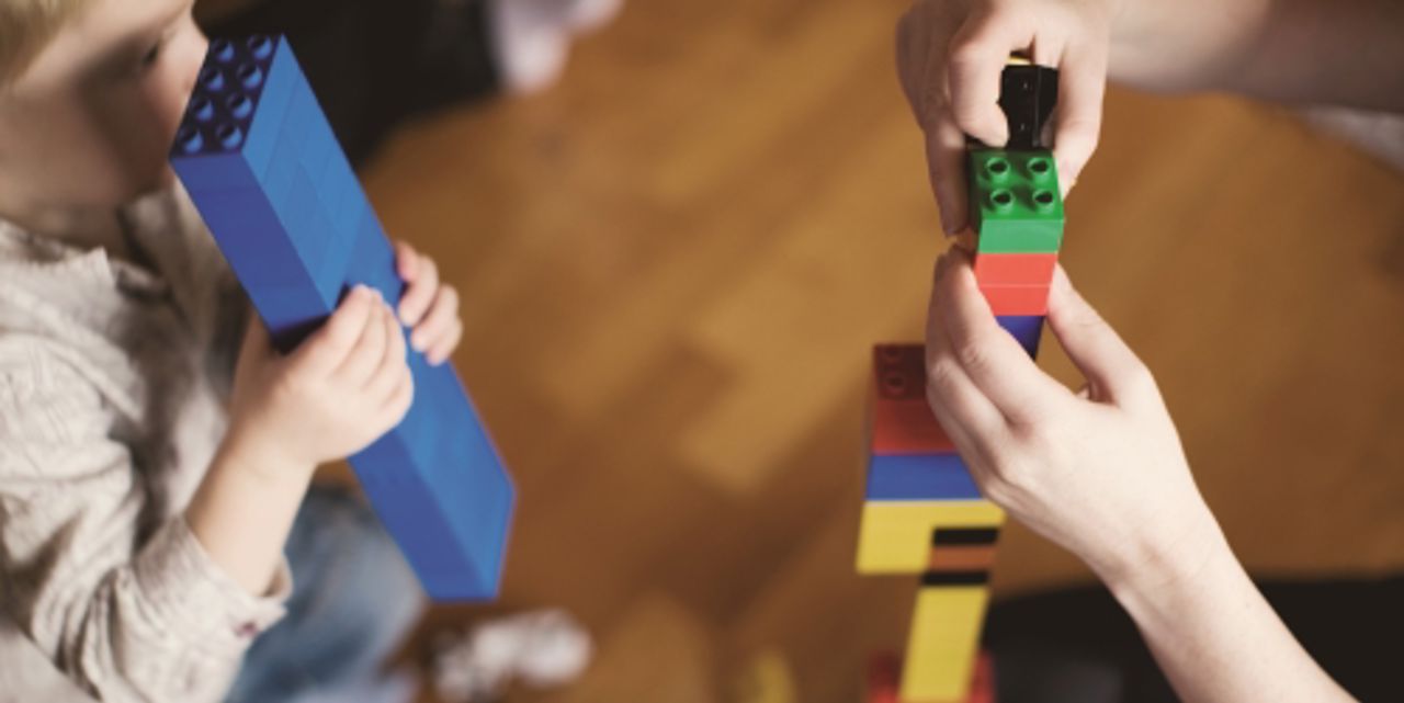 Child playing with parent